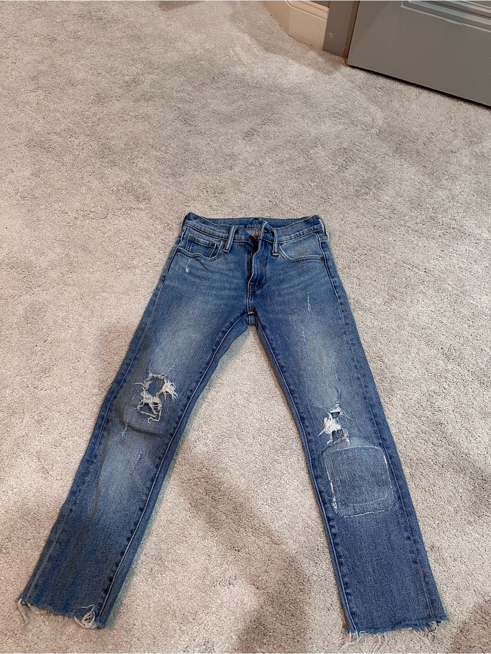 Levi’s Distressed Blue Denim Jeans with Knee Patch